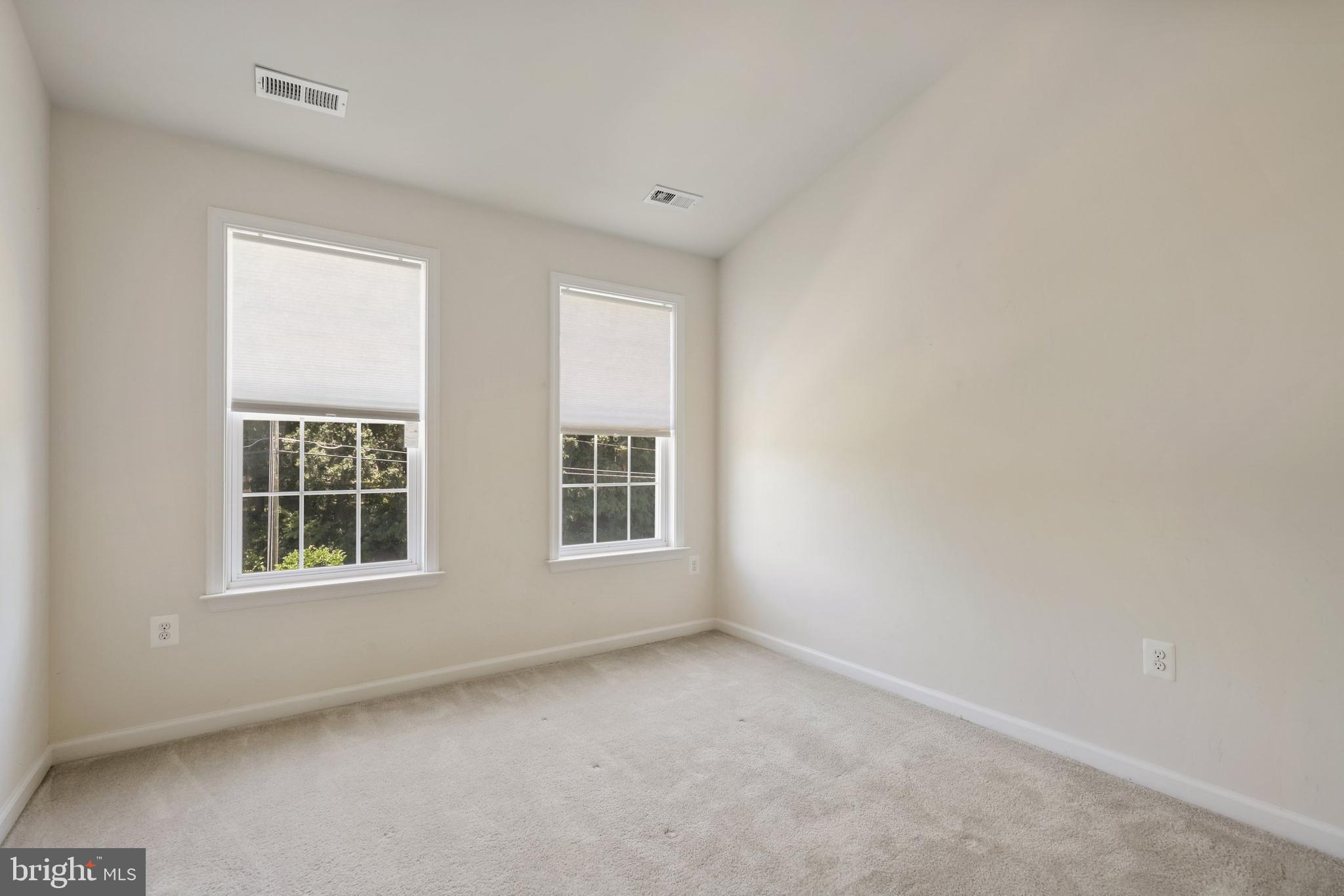 17666 Possum Point Road Dumfries, VA 22026 - Photo 16 of 40 an empty room with windows