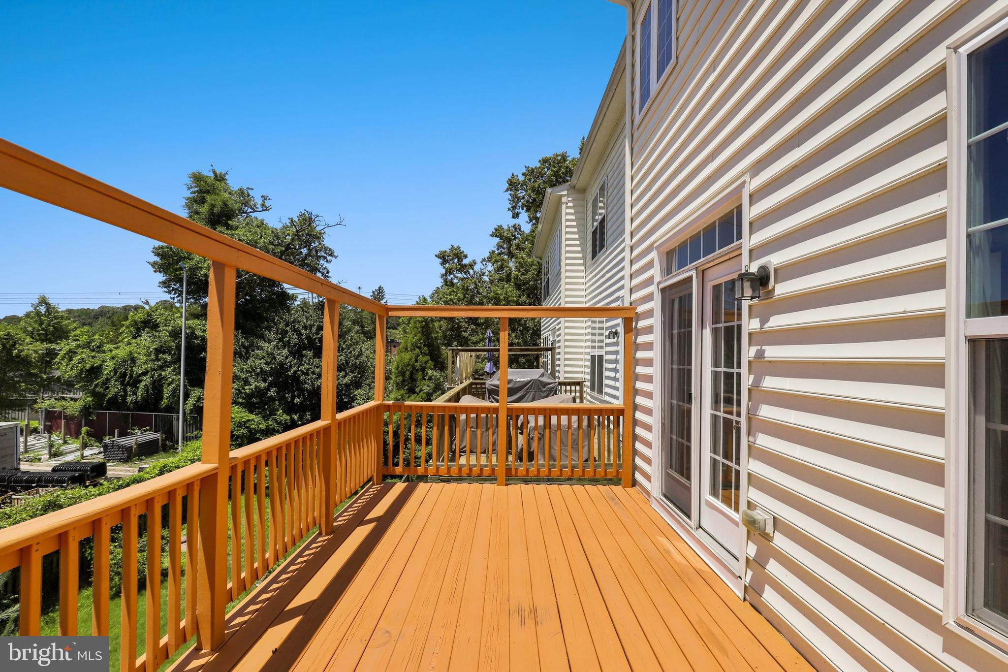 17666 Possum Point Road Dumfries, VA 22026 - Photo 40 of 40 a view of balcony with wooden floor and outdoor seating