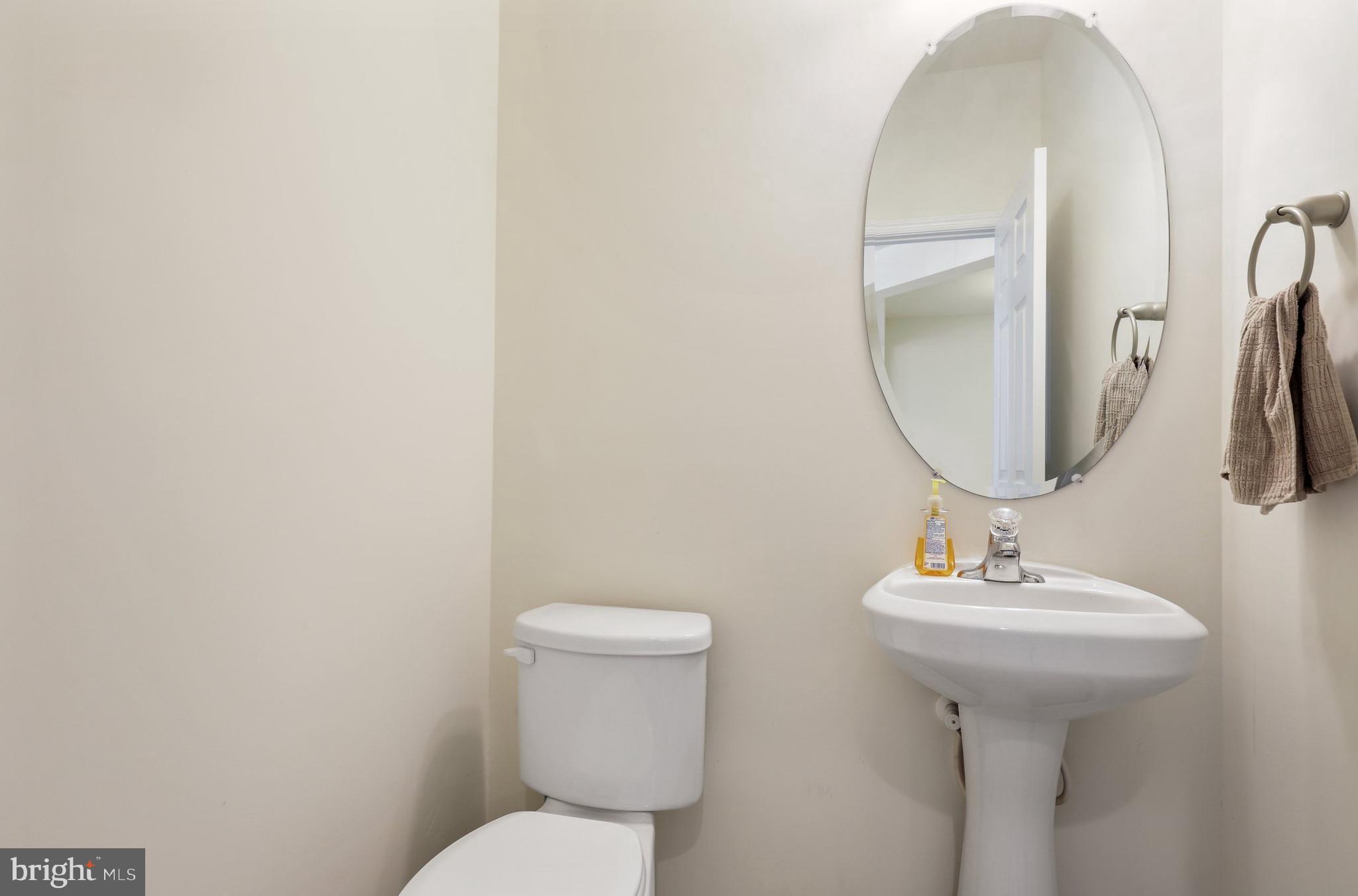 17666 Possum Point Road Dumfries, VA 22026 - Photo 7 of 40 a bathroom with a toilet sink and mirror