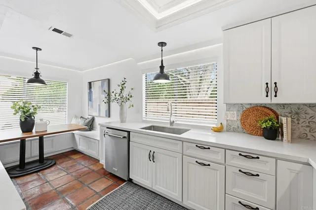 a view of kitchen with sink microwave and refrigerator