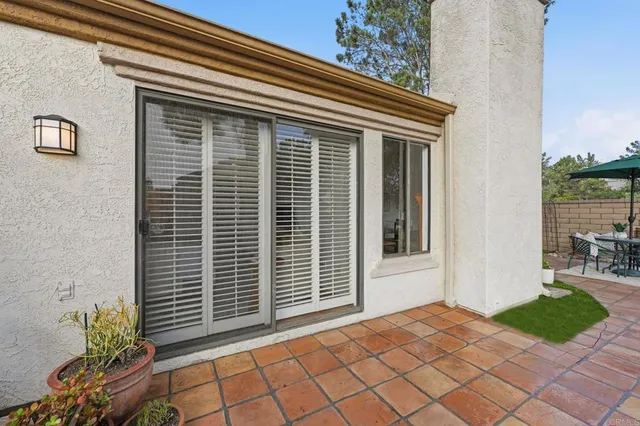 a view of a chairs and table on the terrace