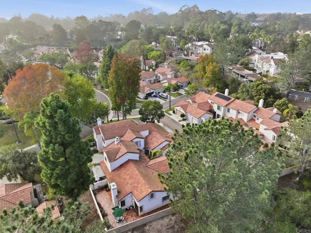 an aerial view of house with yard