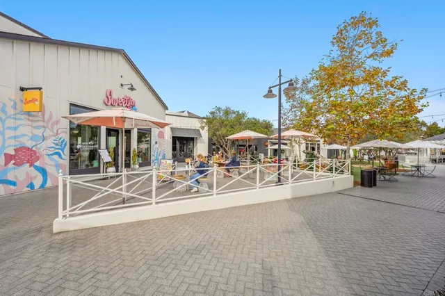 a view of a patio with swimming pool table and chairs