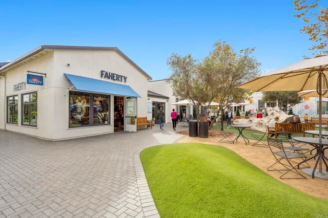 a view of a patio with couches and potted plants