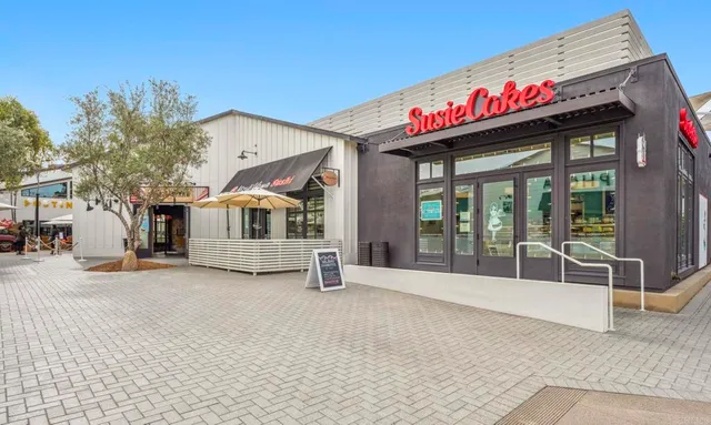 a view of a building with door outdoor space and seating area