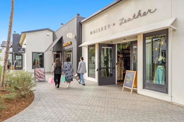 a view of a table and chairs under an umbrella