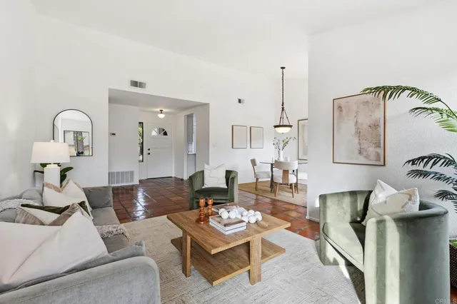 a living room with furniture and a table