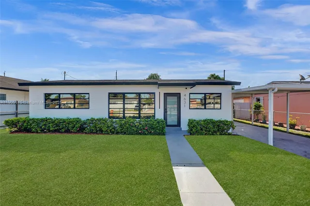 front view of a house with a yard