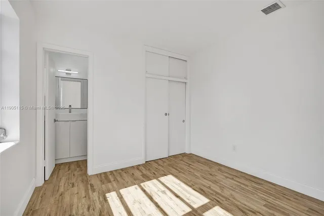 a view of a bedroom from the hallway