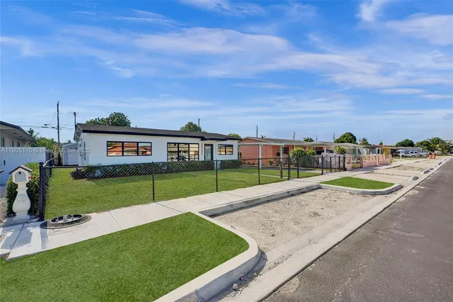 a view of swimming pool with a yard