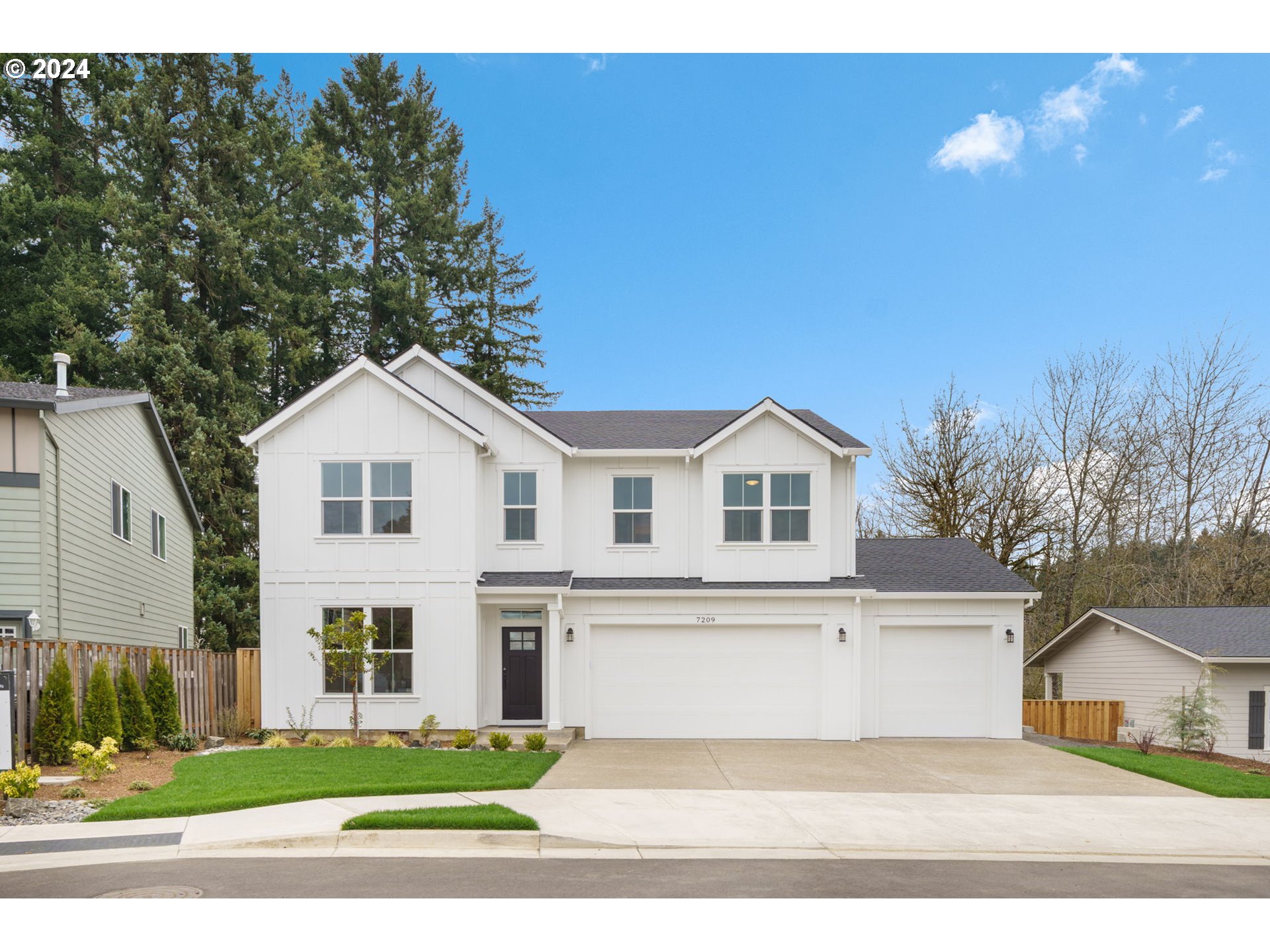 7209 Northeast Ridge Drive, Unit LOT 1 Hillsboro, OR 97124 - Photo 1 of 25 a view of a white house with a yard