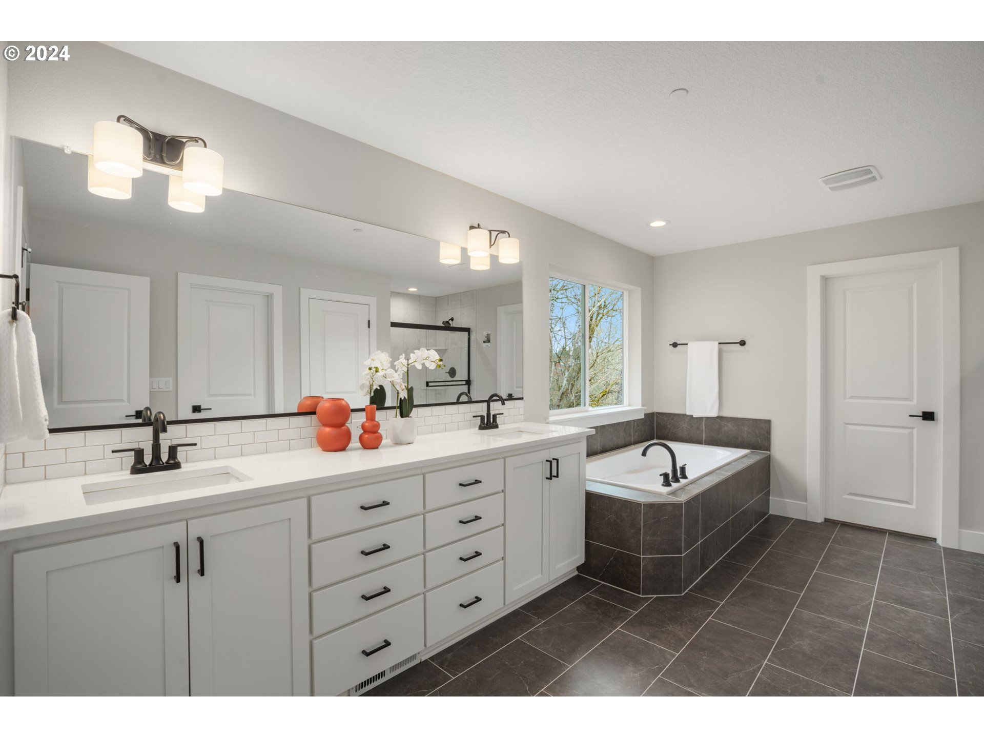 7209 Northeast Ridge Drive, Unit LOT 1 Hillsboro, OR 97124 - Photo 14 of 25 a bathroom with a double vanity sink mirror and bathtub