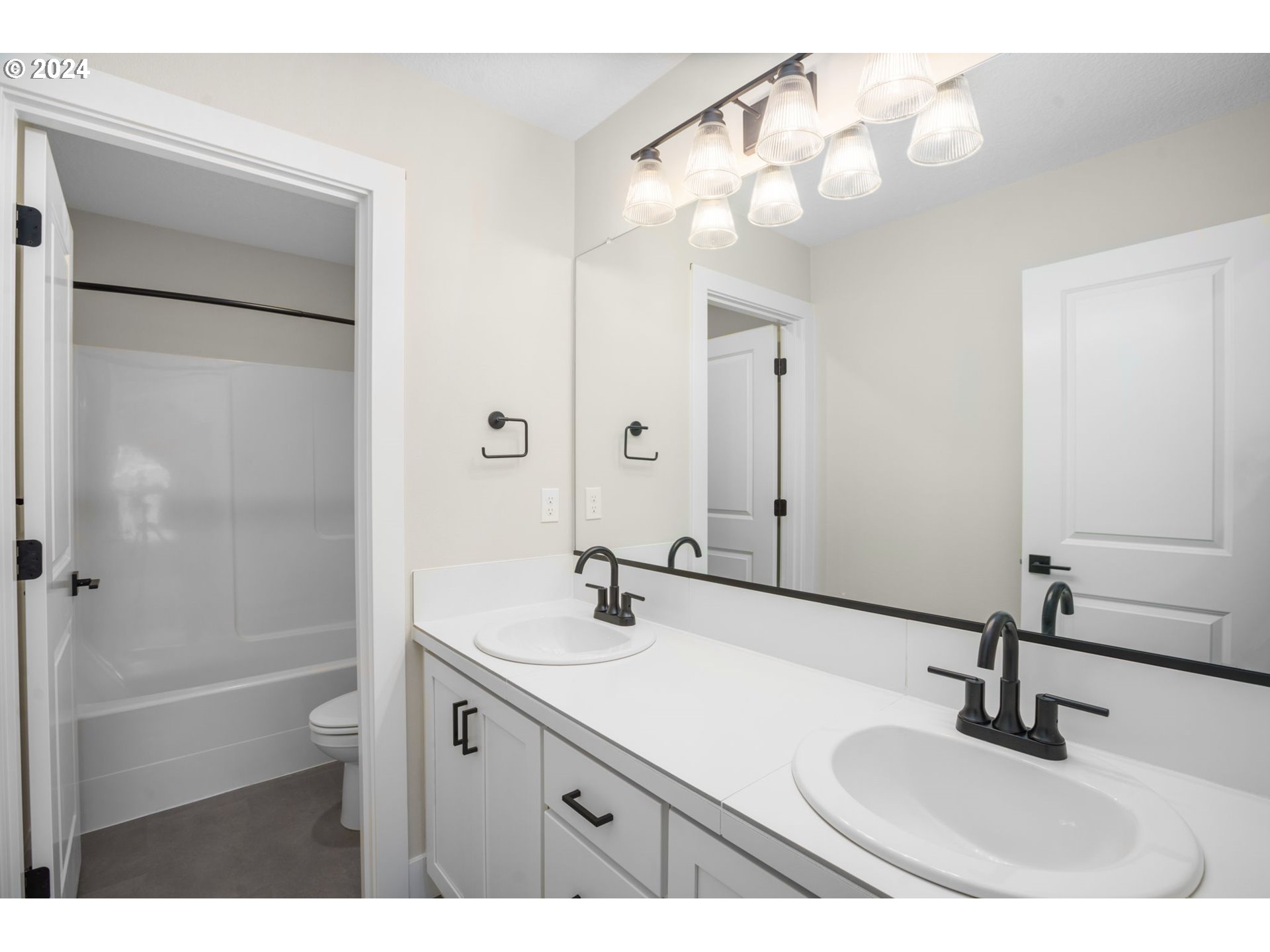 7209 Northeast Ridge Drive, Unit LOT 1 Hillsboro, OR 97124 - Photo 18 of 25 a bathroom with a sink and a mirror