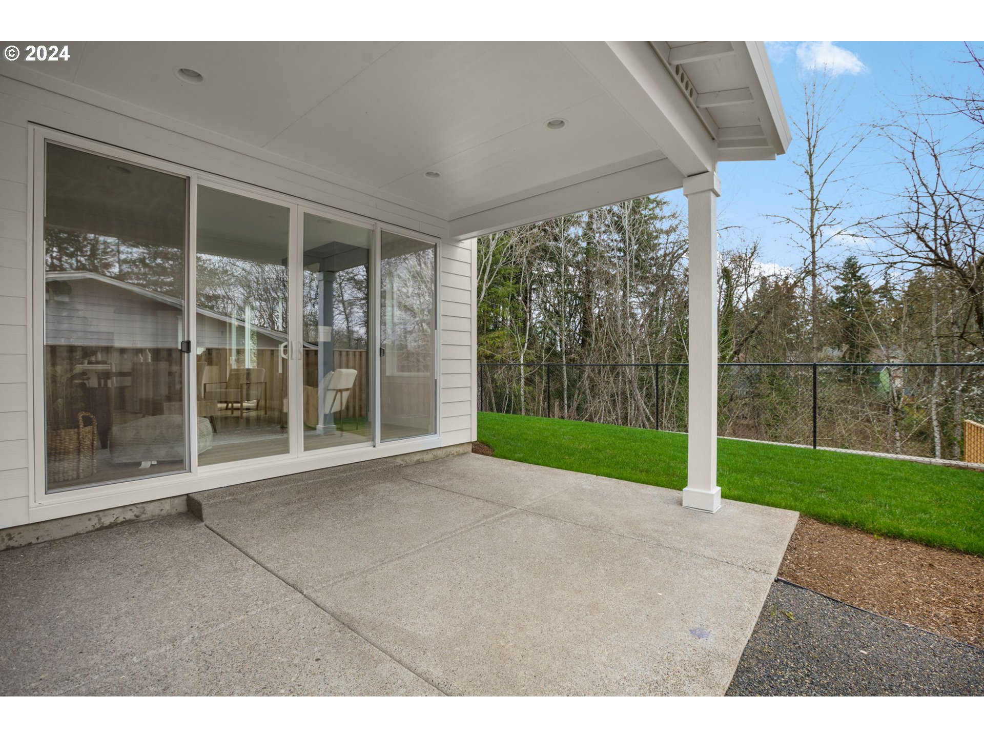 7209 Northeast Ridge Drive, Unit LOT 1 Hillsboro, OR 97124 - Photo 21 of 25 a view of a big room with a big yard and large tree