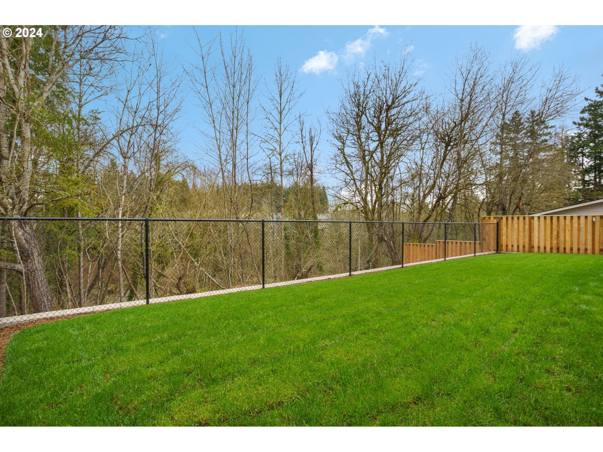 7209 Northeast Ridge Drive, Unit LOT 1 Hillsboro, OR 97124 - Photo 23 of 25 a garden with trees in front of it