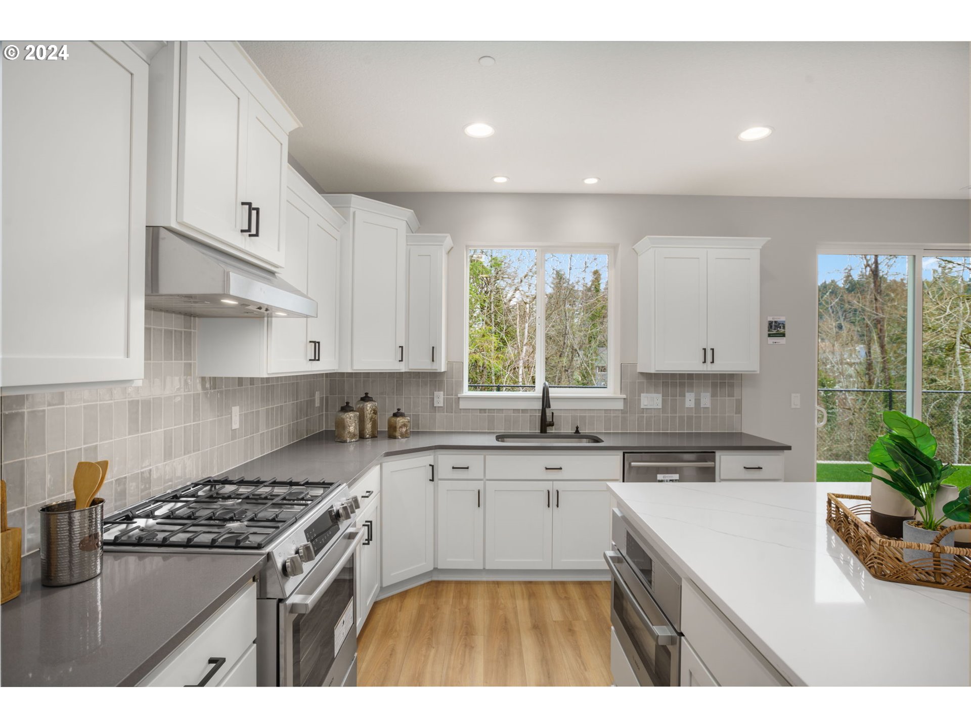 7209 Northeast Ridge Drive, Unit LOT 1 Hillsboro, OR 97124 - Photo 4 of 25 a kitchen with a sink stove and cabinets