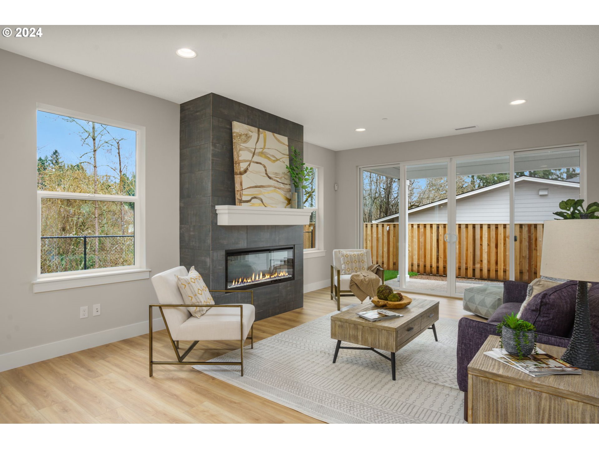 7209 Northeast Ridge Drive, Unit LOT 1 Hillsboro, OR 97124 - Photo 8 of 25 a living room with furniture and a fireplace