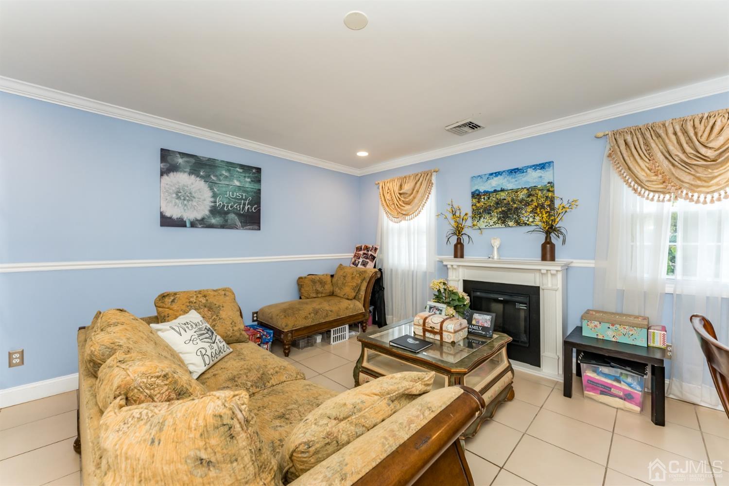199 Stafford Road Colonia, NJ 07067 - Photo 14 of 44 a living room with furniture and a fireplace