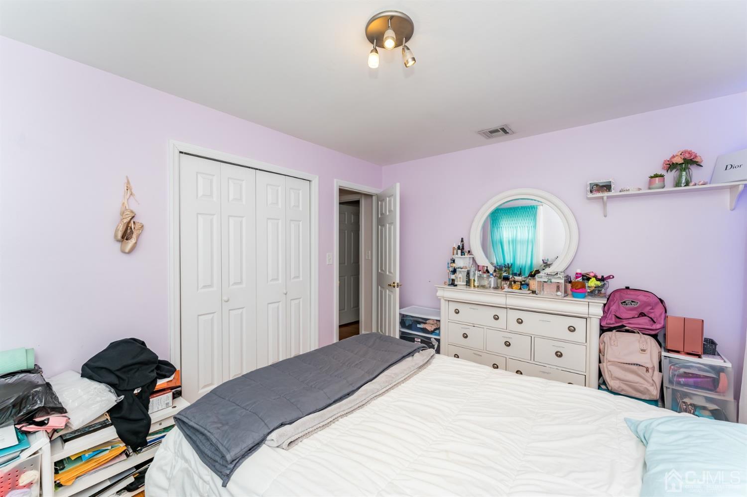199 Stafford Road Colonia, NJ 07067 - Photo 22 of 44 a bedroom with a bed and a dresser in it