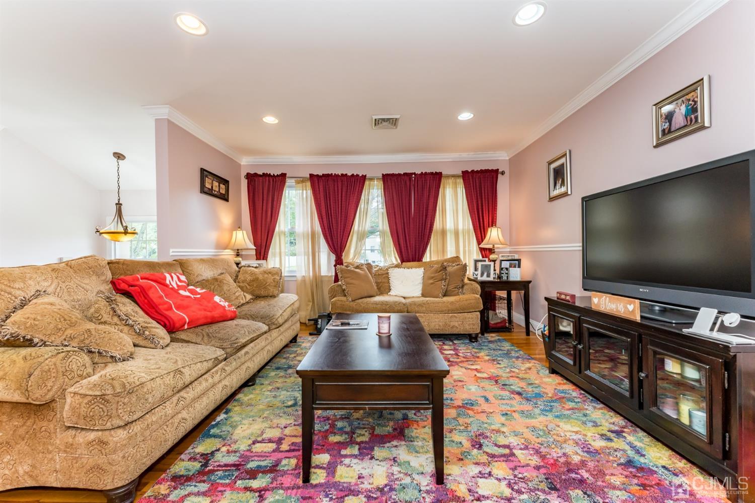 199 Stafford Road Colonia, NJ 07067 - Photo 4 of 44 a living room with furniture and a flat screen tv