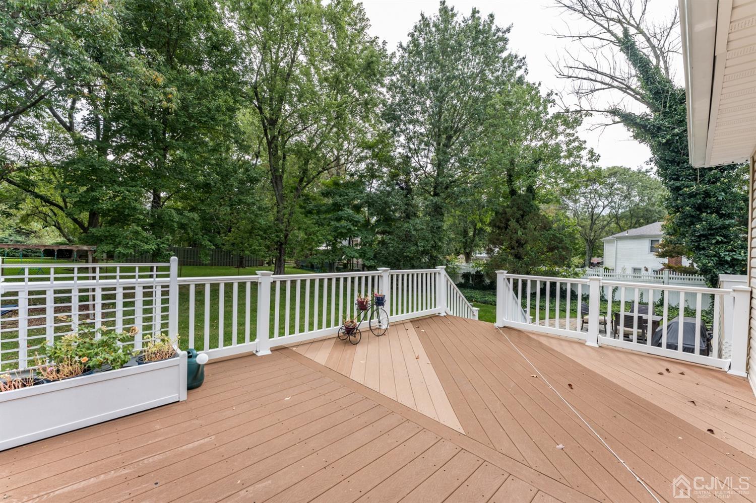 199 Stafford Road Colonia, NJ 07067 - Photo 36 of 44 a view of balcony with wooden floor and fence