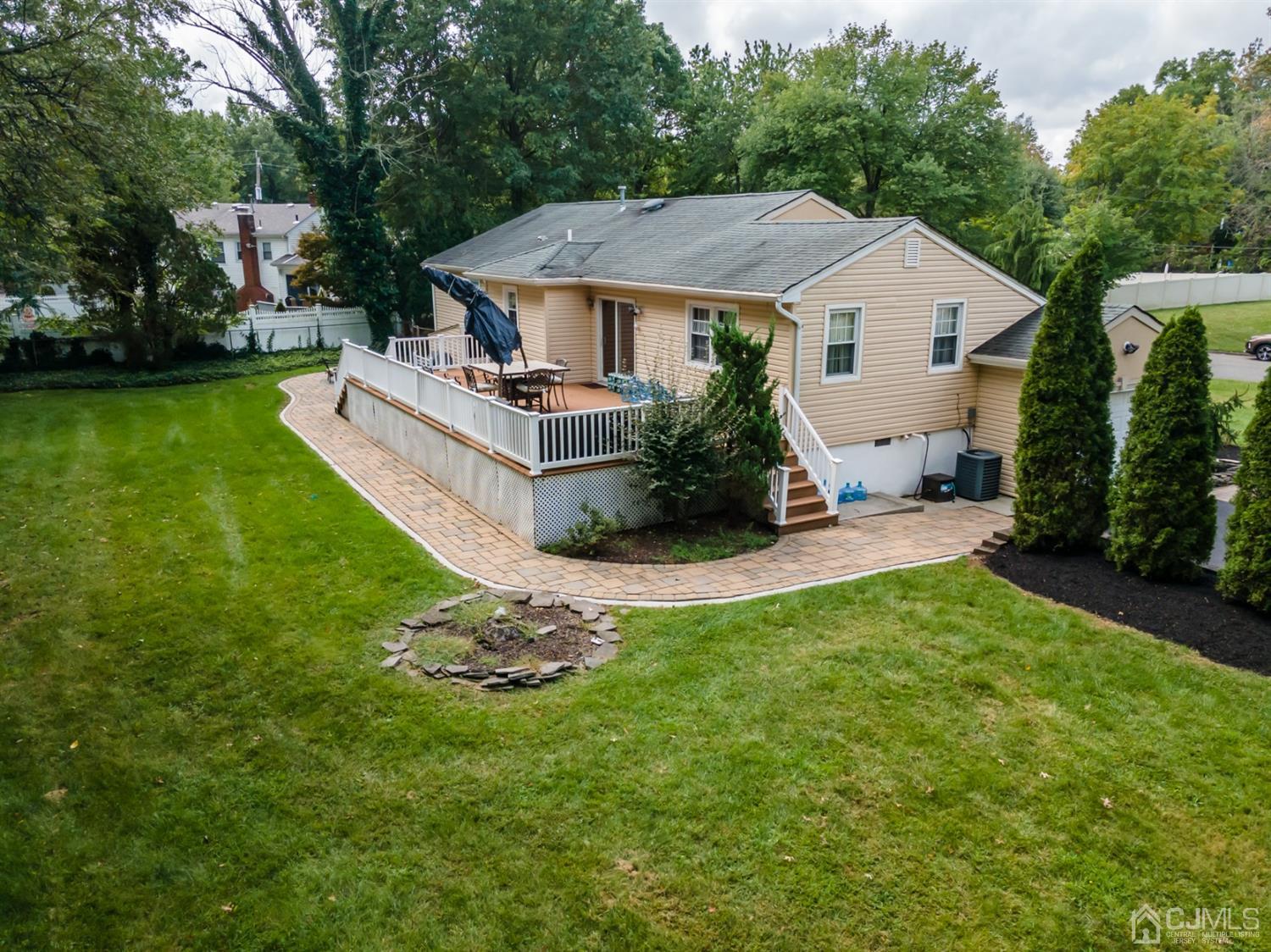 199 Stafford Road Colonia, NJ 07067 - Photo 40 of 44 a aerial view of a house with a yard table and chairs