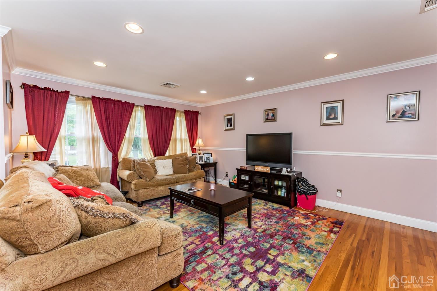 199 Stafford Road Colonia, NJ 07067 - Photo 5 of 44 a living room with furniture and a flat screen tv