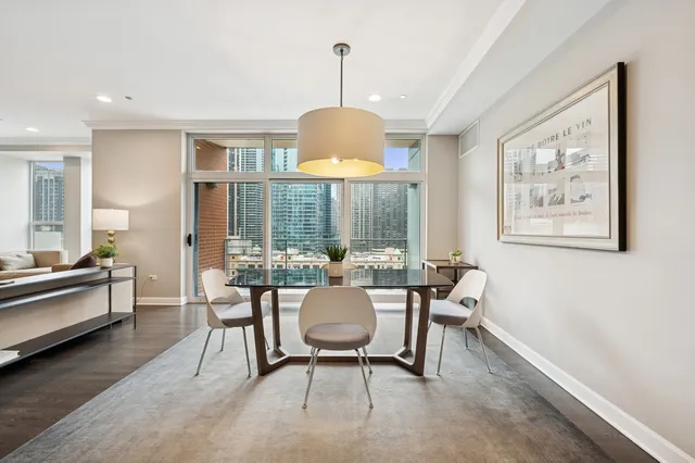 a view of a dining room with furniture window and outside view