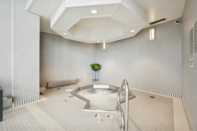 a view of a balcony with two chairs and a table