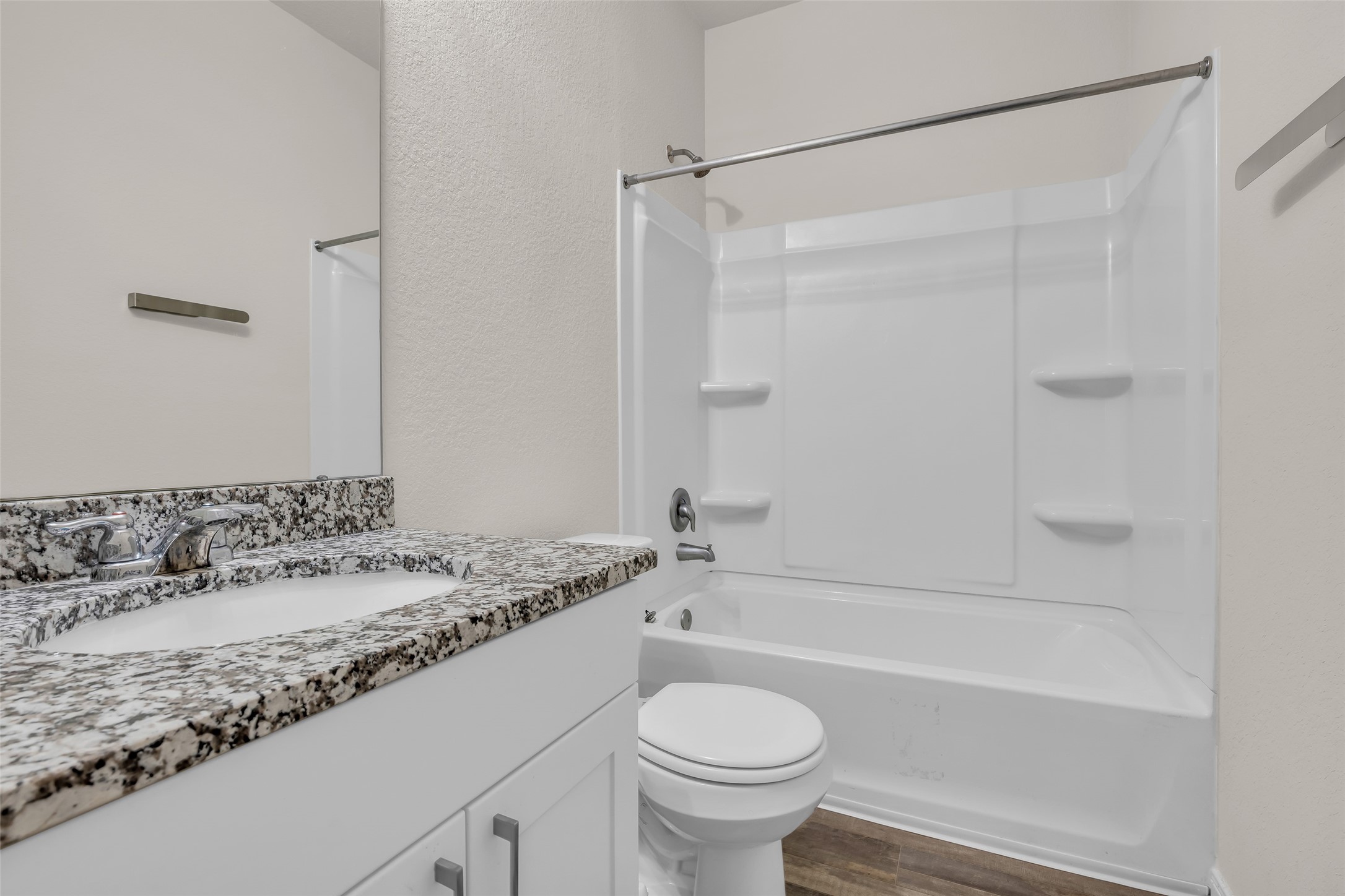 2511 17th Street Hempstead, TX 77445 - Photo 15 of 23 a bathroom with a granite countertop sink toilet and shower