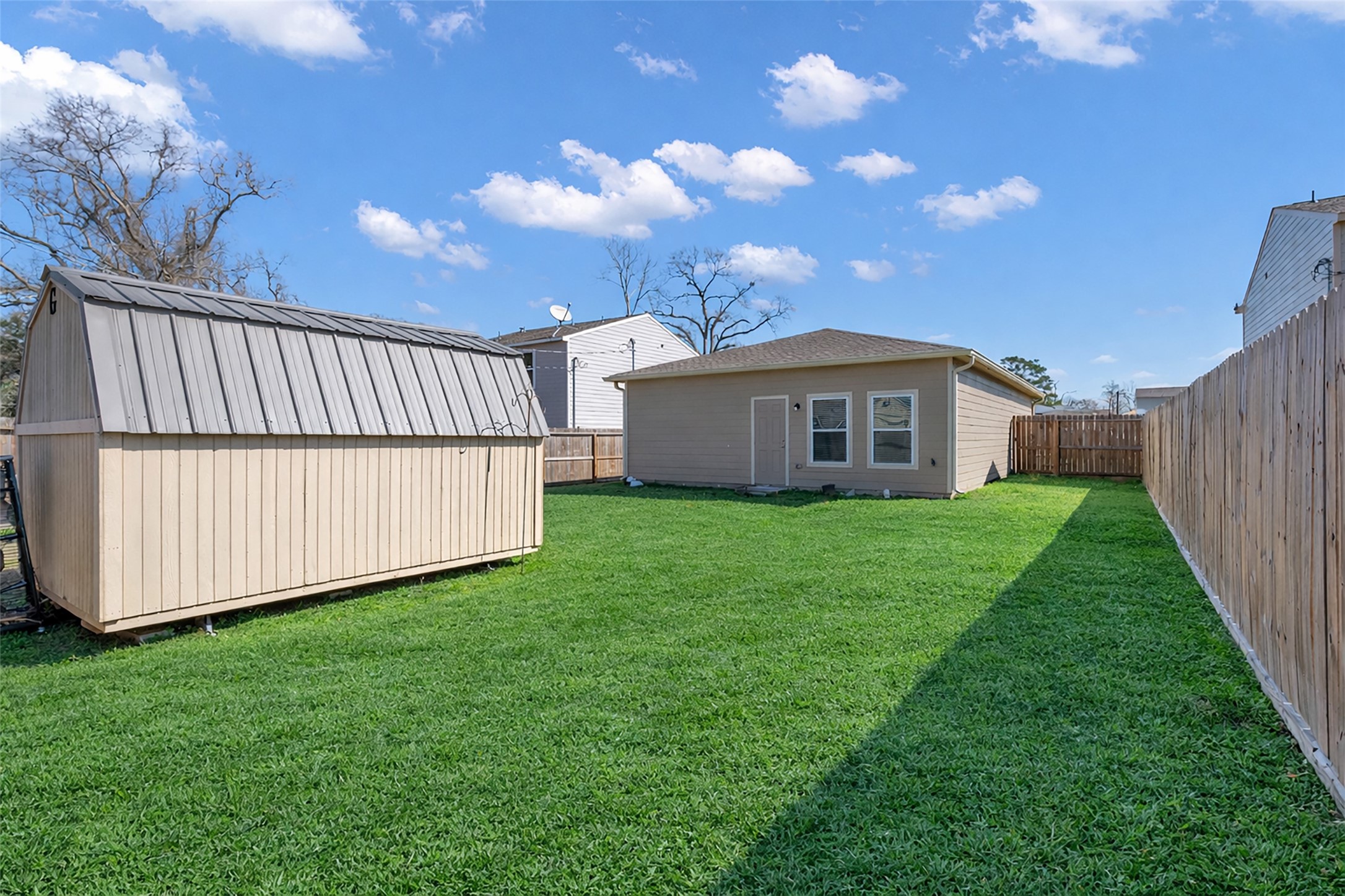 2511 17th Street Hempstead, TX 77445 - Photo 22 of 23 a view of a house with a yard