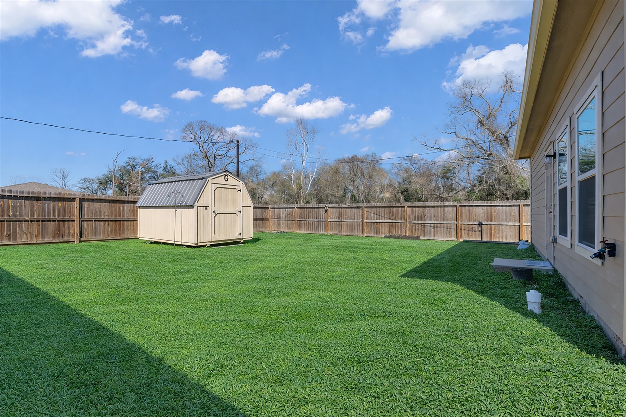 2511 17th Street Hempstead, TX 77445 - Photo 23 of 23 a view of a backyard with grass and entertaining space