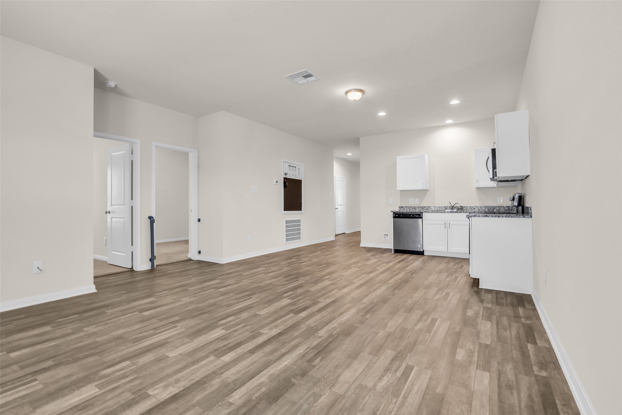 2511 17th Street Hempstead, TX 77445 - Photo 10 of 23 a view of kitchen view with wooden floor and window