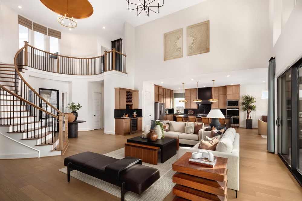 6414 Seville Street Manvel, TX 77578 - Photo 4 of 9 a living room with furniture a fireplace and a chandelier