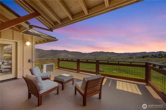 a view of a chairs and table on the terrace