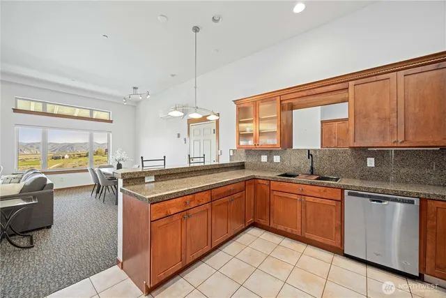 a kitchen with a sink stove and cabinets
