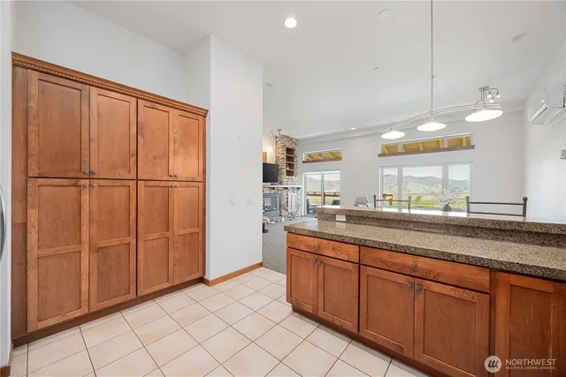 a kitchen with cabinets and white appliances