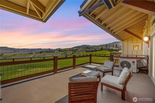 a view of swimming pool with a lounge chairs