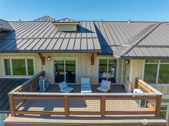 a view of house with a tub and windows