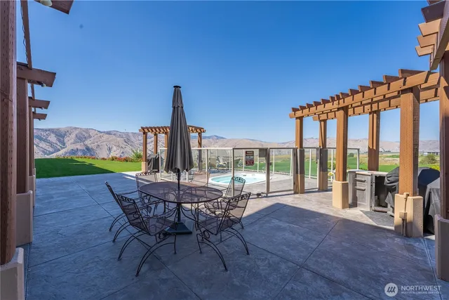 a patio with table and chairs