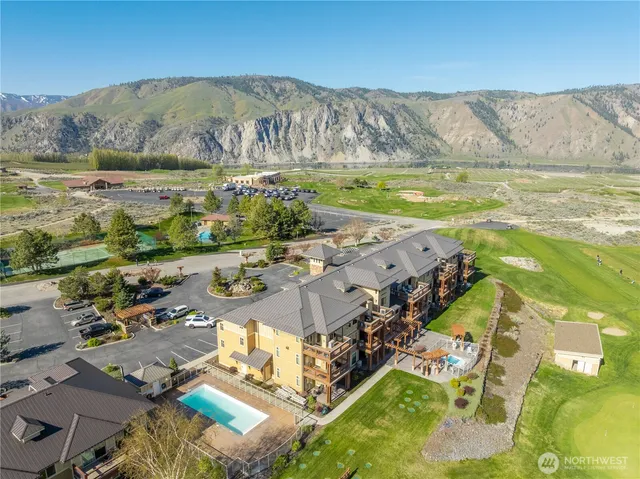 an aerial view of residential houses with outdoor space