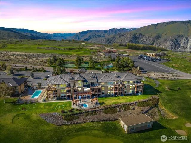 a view of a town with mountains in the background