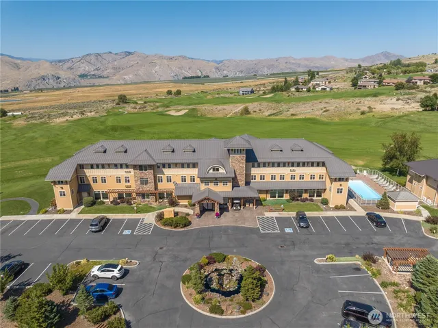 an aerial view of a house with outdoor space