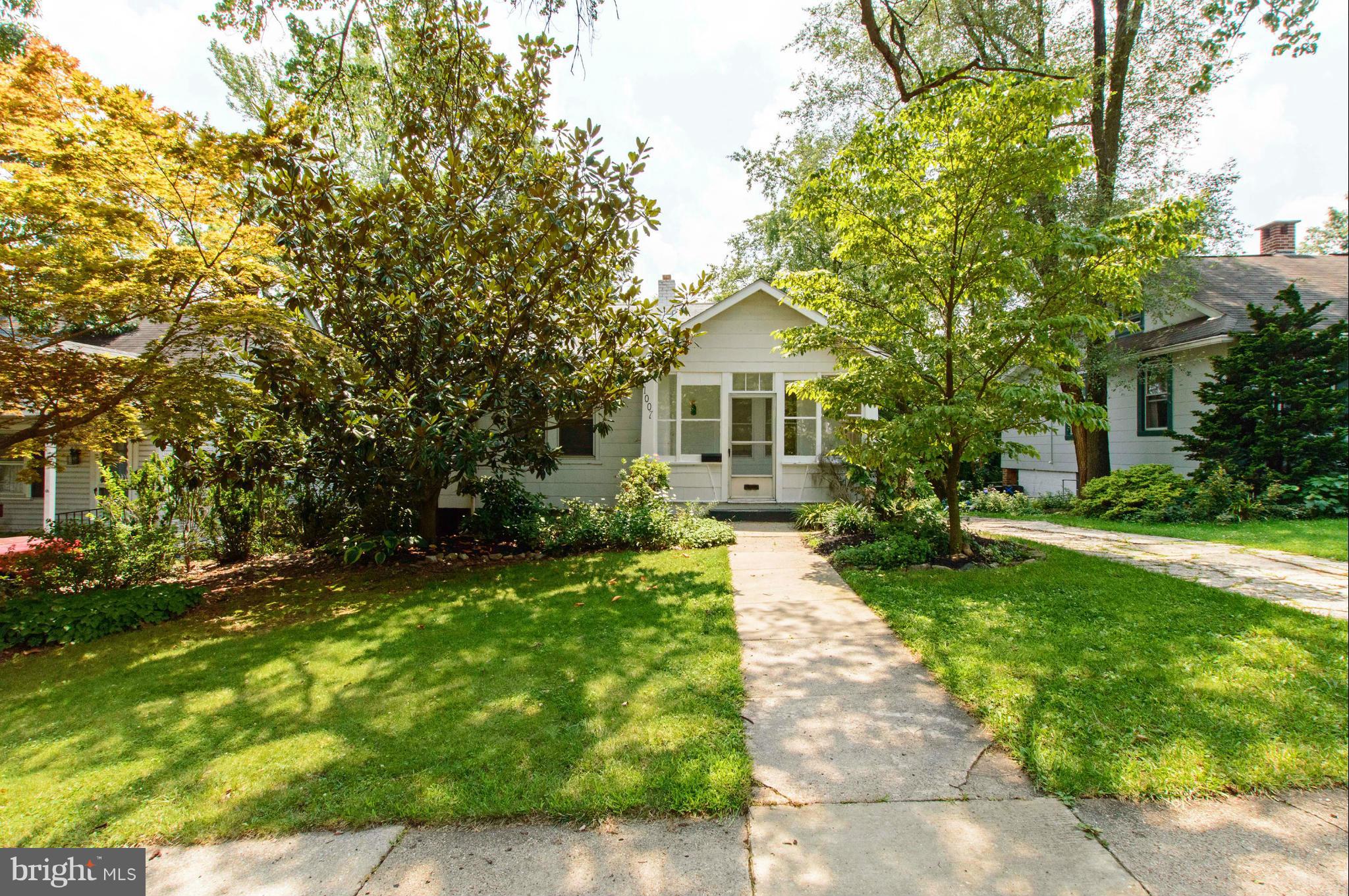 1007 Overbrook Road Baltimore, MD 21239 - Photo 2 of 30 a front view of a house with a yard