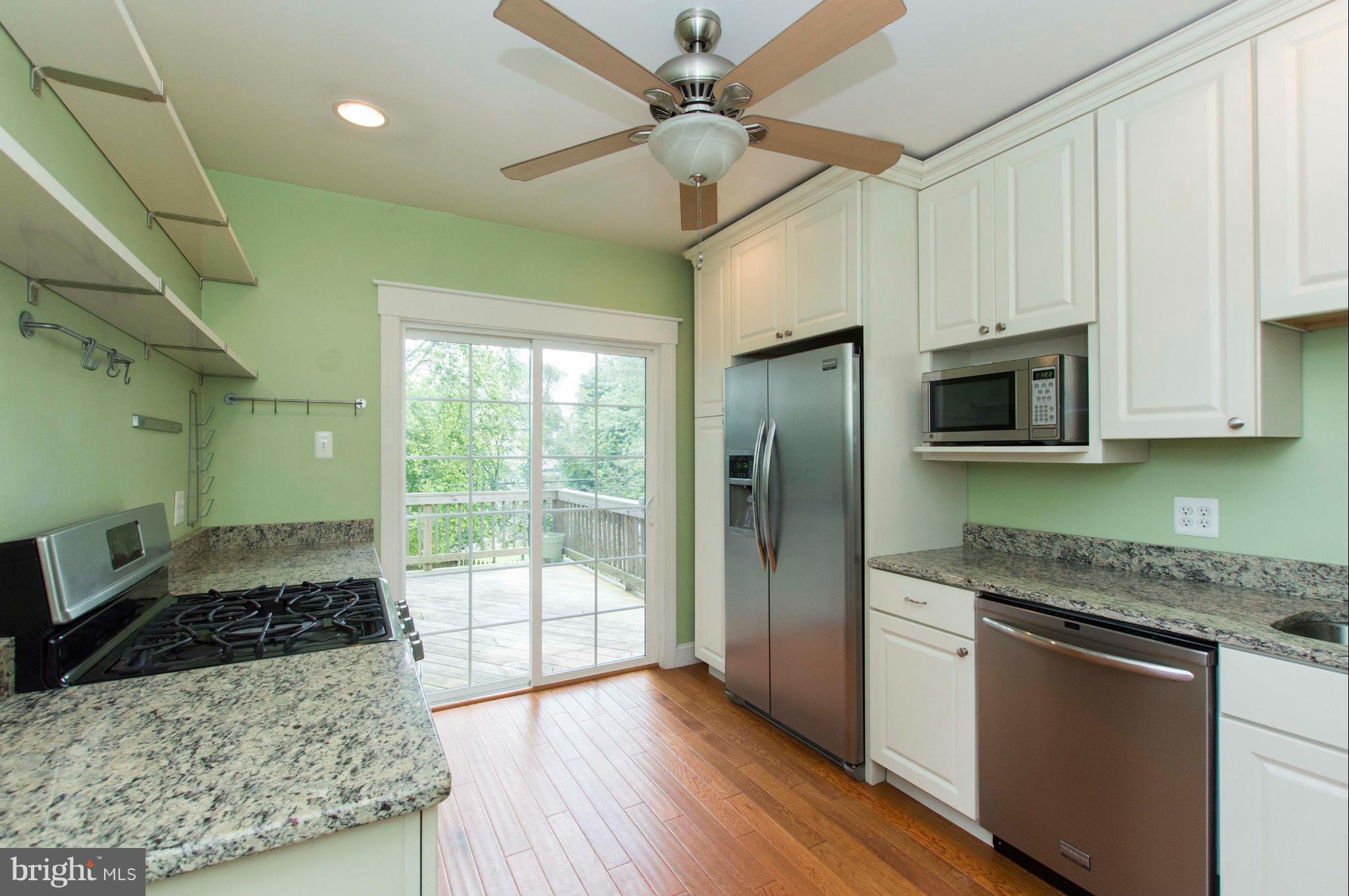 1007 Overbrook Road Baltimore, MD 21239 - Photo 13 of 30 a kitchen with granite countertop a stove and a sink