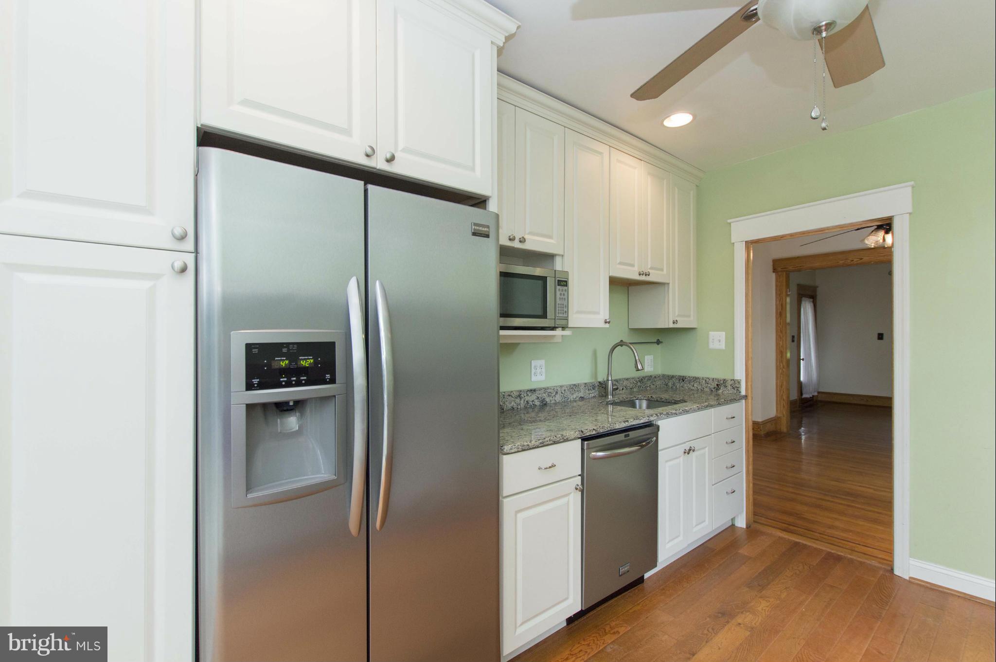1007 Overbrook Road Baltimore, MD 21239 - Photo 14 of 30 a kitchen with stainless steel appliances granite countertop a refrigerator and a sink