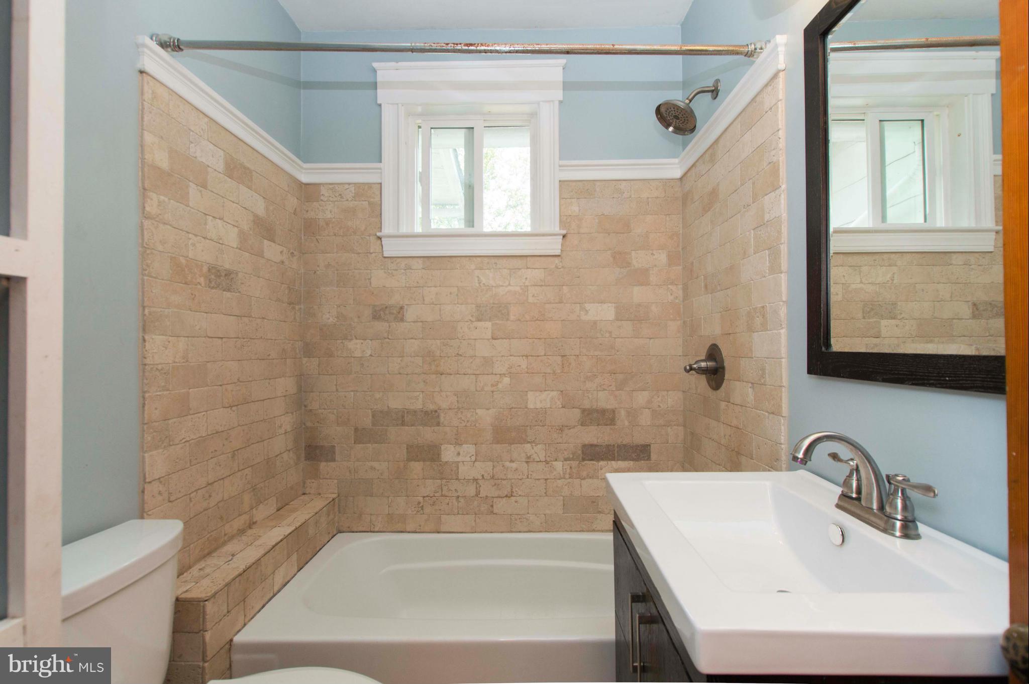 1007 Overbrook Road Baltimore, MD 21239 - Photo 20 of 30 a bathroom with a sink and a bathtub