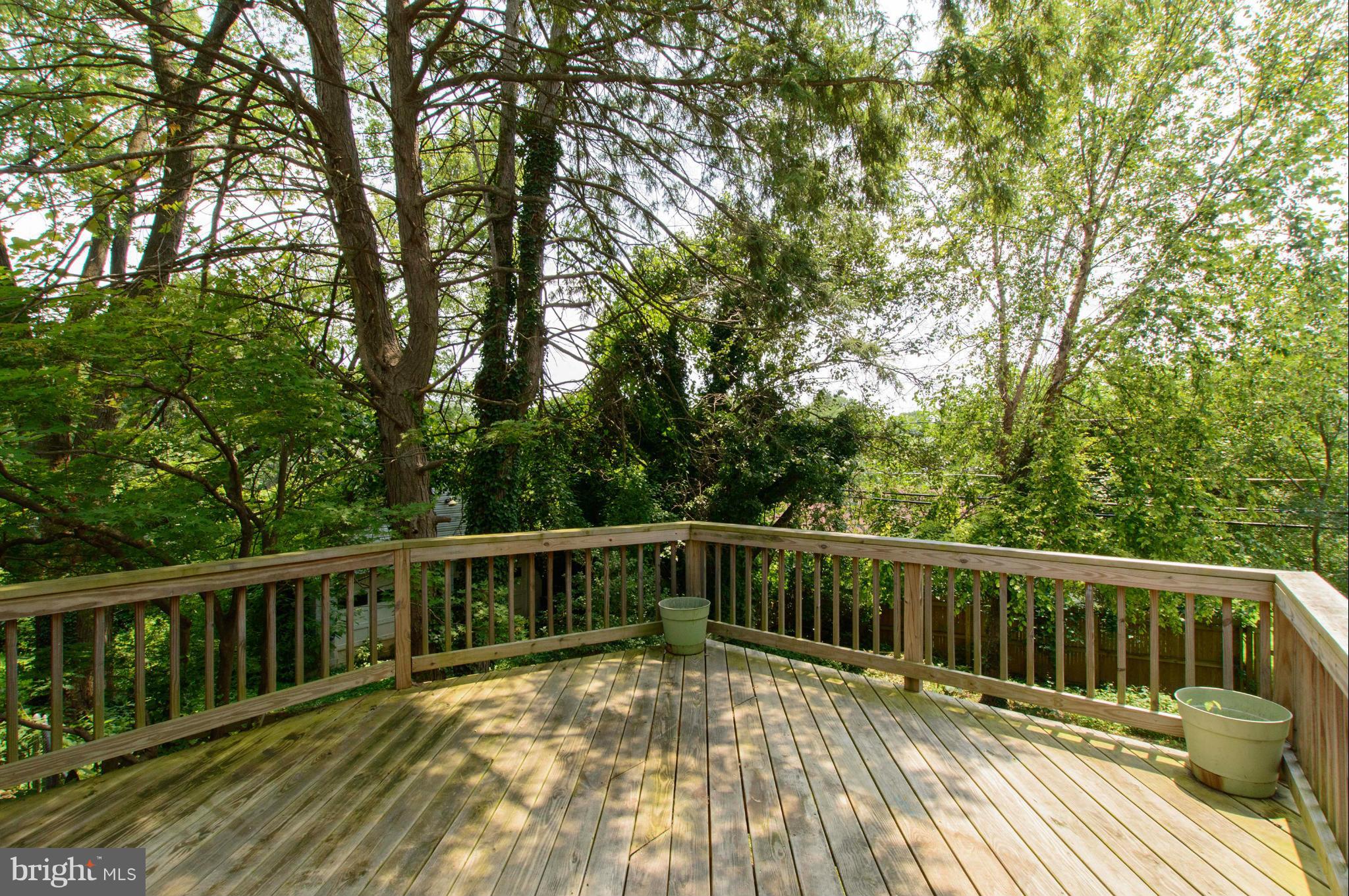 1007 Overbrook Road Baltimore, MD 21239 - Photo 26 of 30 a view of balcony with wooden floor and fence