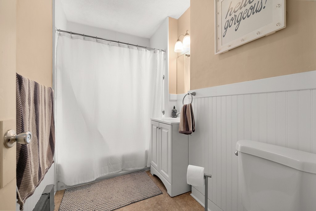 16 Sunset Road, Unit 1 Watertown, MA 02472 - Photo 11 of 17 a bathroom with a shower and toilet