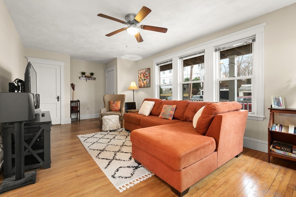16 Sunset Road, Unit 1 Watertown, MA 02472 - Photo 4 of 17 a living room with furniture fireplace and a window